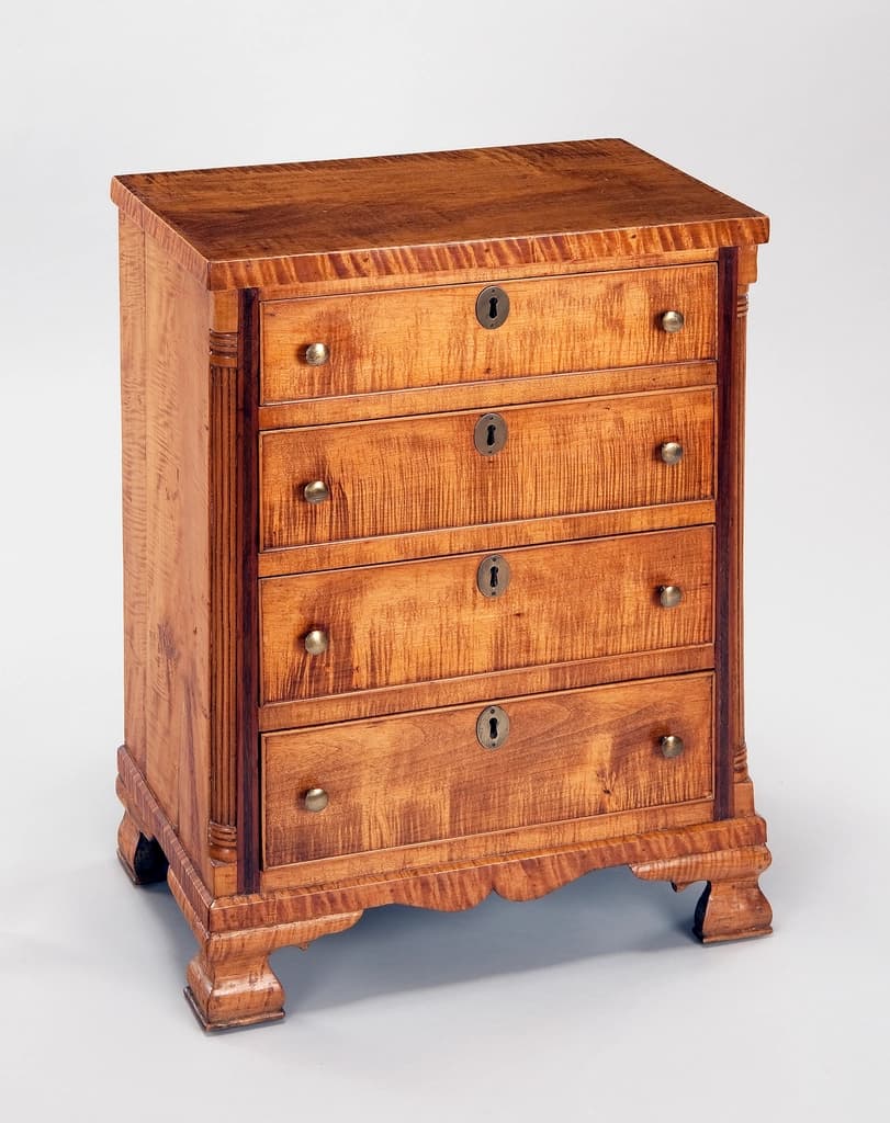 A restored 1940s tiger maple chest of drawers